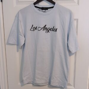 NWOT...it fell off MIRI Rum Label Tee Blue Crew Neck Short Sleeve Tee Size Small